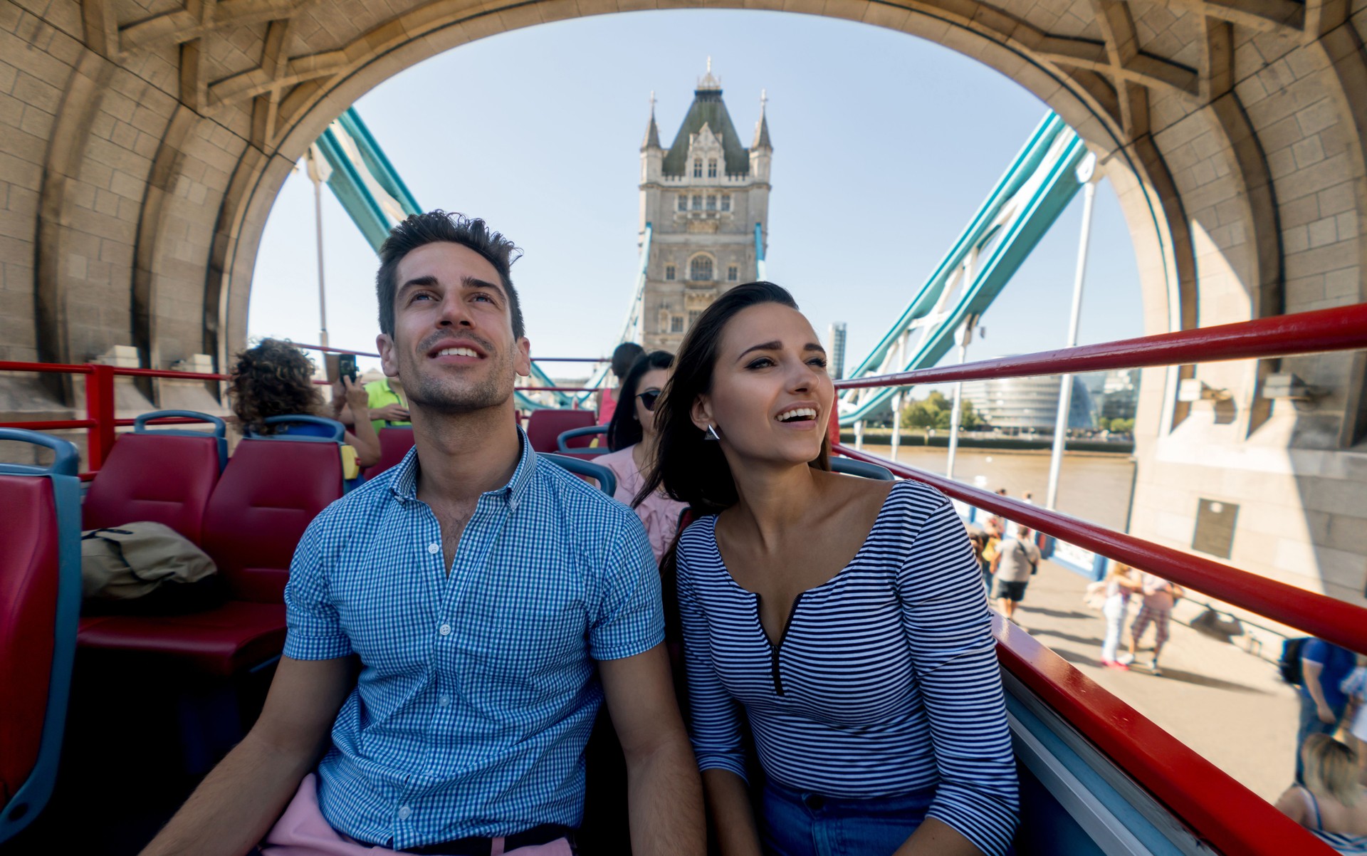 Happy couple on a tour bus 